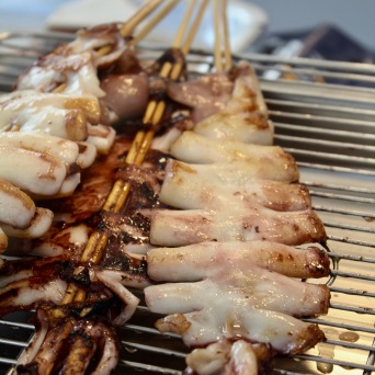 Festival food: grilled squid on skewers